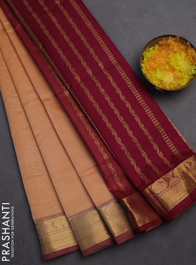 Silk cotton saree pale orange and dark magenta pink with plain body and zari woven border