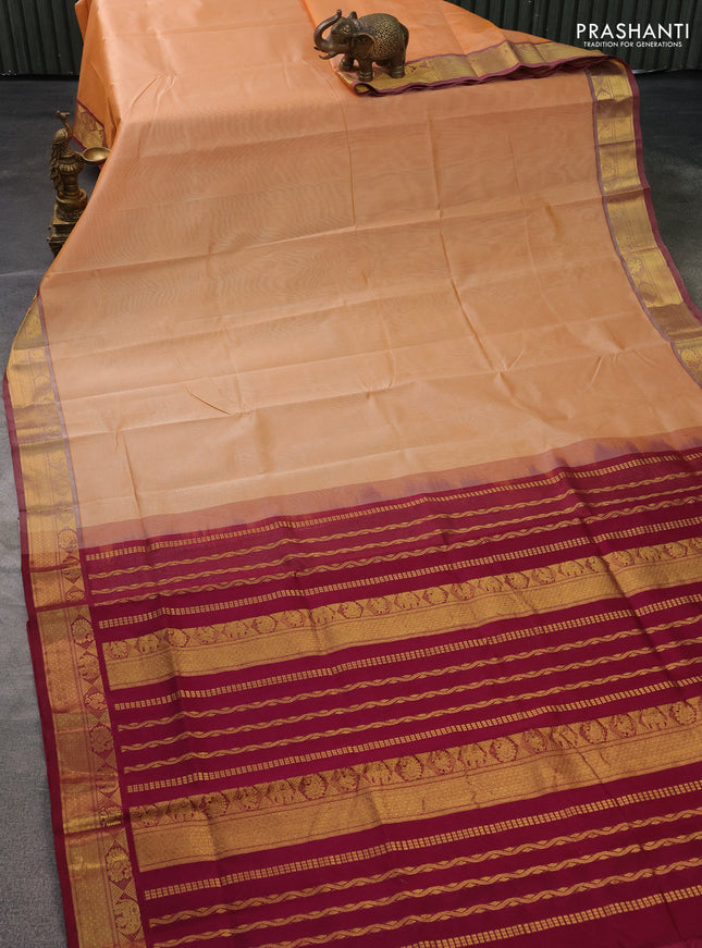 Silk cotton saree pale orange and dark magenta pink with plain body and zari woven border