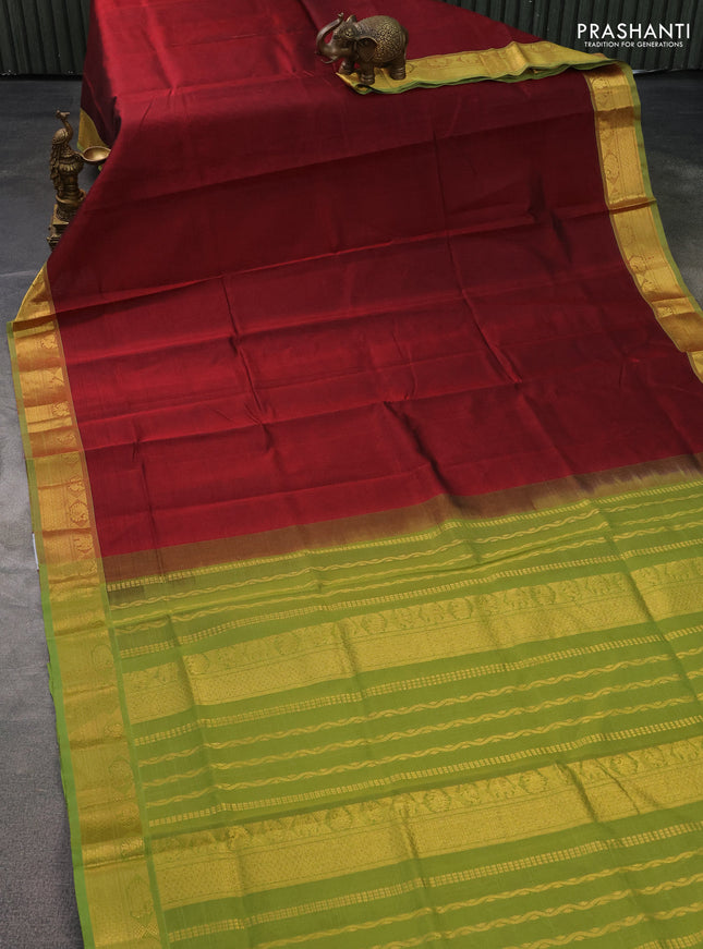 Silk cotton saree maroon and light green with plain body and zari woven border