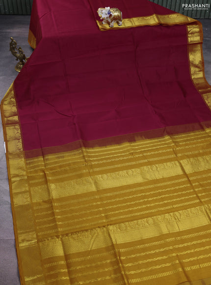 Silk cotton saree dark magenta pink and mustard yellow with plain body and zari woven border