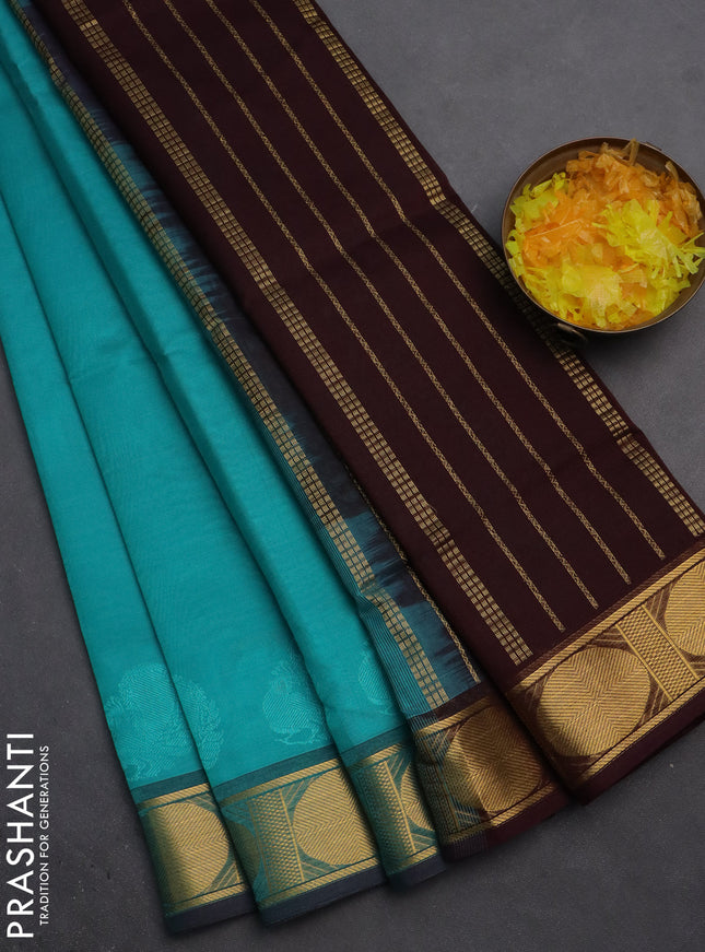 Silk cotton saree teal blue and brown with plain body and zari woven border