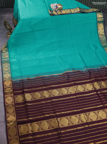 Silk cotton saree teal blue and brown with plain body and zari woven border