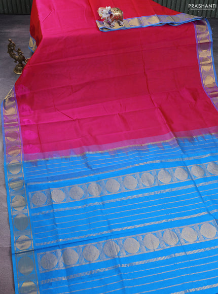 Silk cotton saree pink and cs blue with plain body and zari woven border