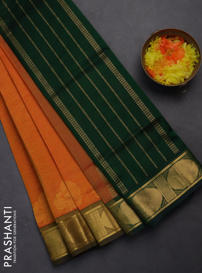 Silk cotton saree orange and green with plain body and zari woven border