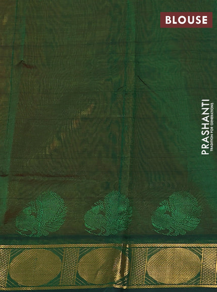 Silk cotton saree orange and green with plain body and zari woven border