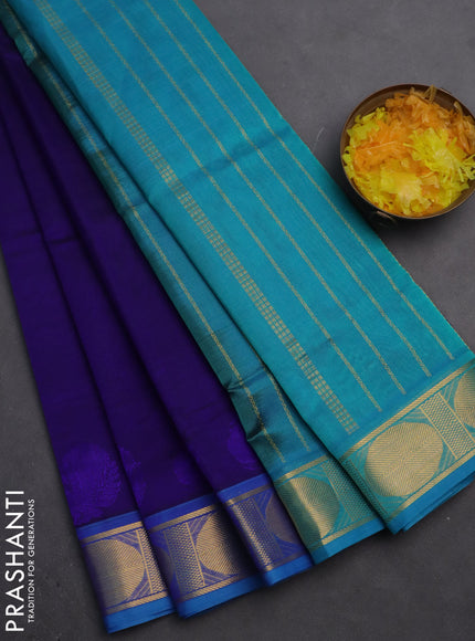 Silk cotton saree navy blue and teal blue with plain body and zari woven border