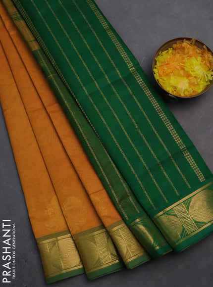 Silk cotton saree mustard yellow and green with plain body and zari woven border