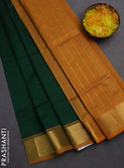 Silk cotton saree green and mustard yellow with plain body and zari woven border