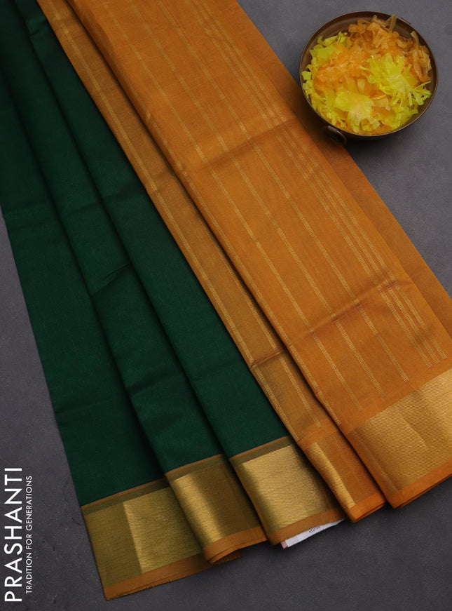Silk cotton saree green and mustard yellow with plain body and zari woven border
