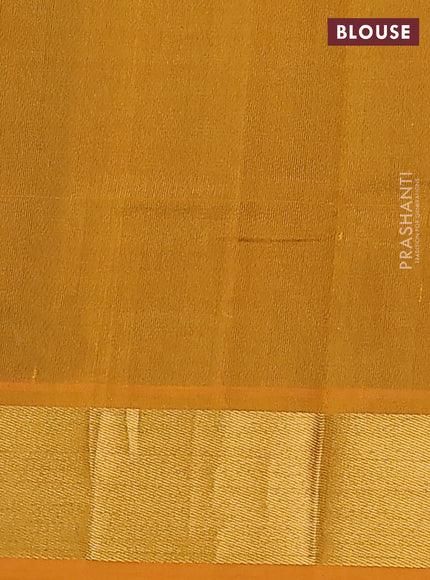 Silk cotton saree green and mustard yellow with plain body and zari woven border