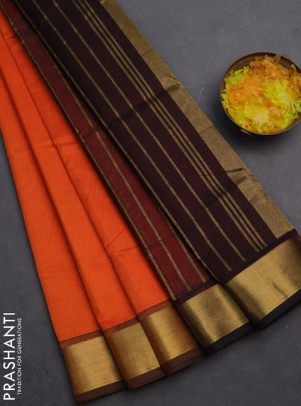 Silk cotton saree orange and coffee brown with plain body and zari woven border