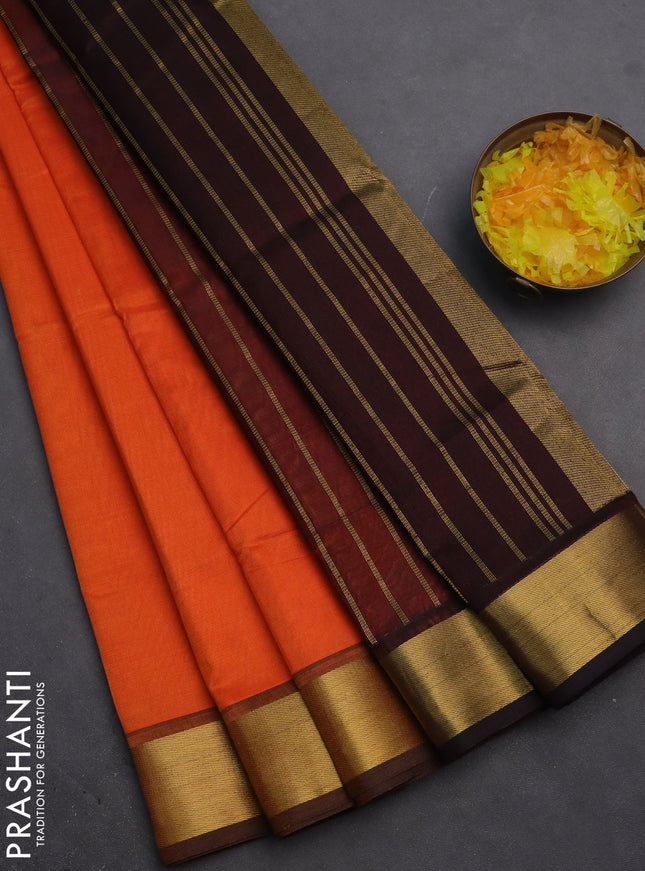 Silk cotton saree orange and coffee brown with plain body and zari woven border