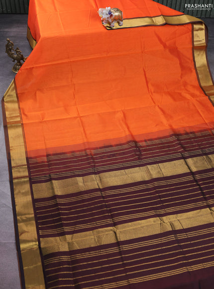 Silk cotton saree orange and coffee brown with plain body and zari woven border
