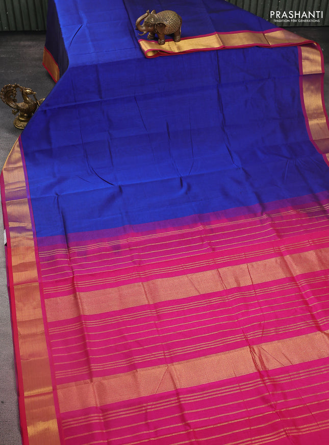 Silk cotton saree dark blue and magenta pink with plain body and zari woven border