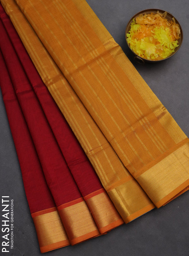 Silk cotton saree maroon and mustard yellow with plain body and zari woven border