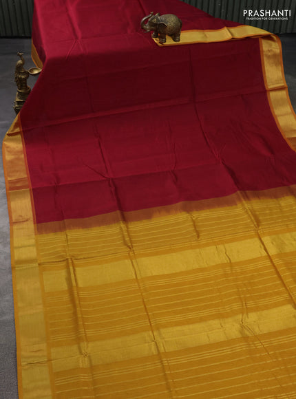 Silk cotton saree maroon and mustard yellow with plain body and zari woven border