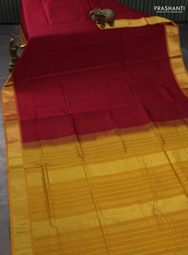 Silk cotton saree maroon and mustard yellow with plain body and zari woven border