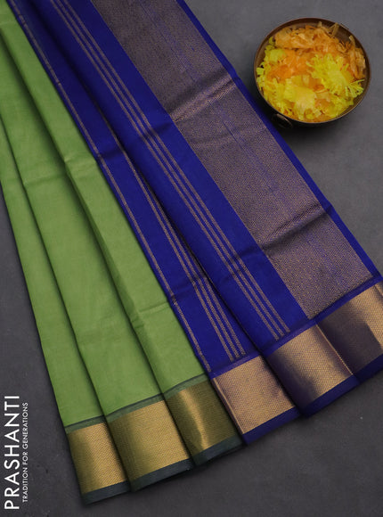 Silk cotton saree pastel green and blue with plain body and zari woven border