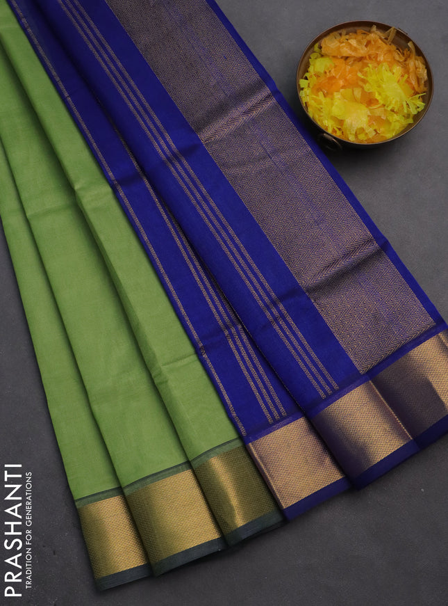 Silk cotton saree pastel green and blue with plain body and zari woven border