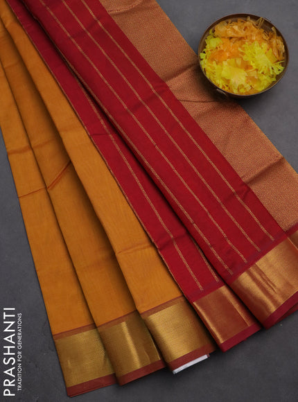 Silk cotton saree mustard yellow and red with plain body and zari woven border