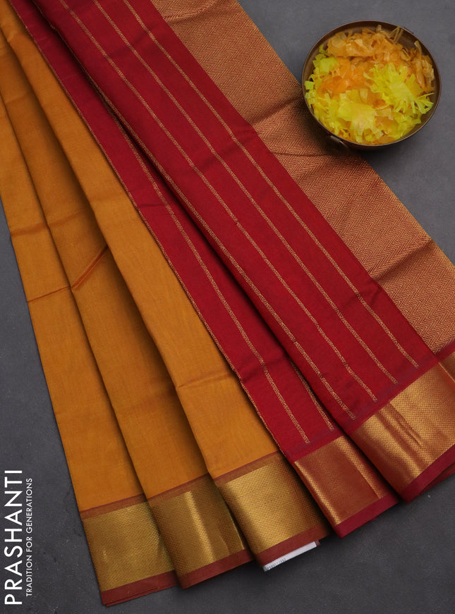 Silk cotton saree mustard yellow and red with plain body and zari woven border