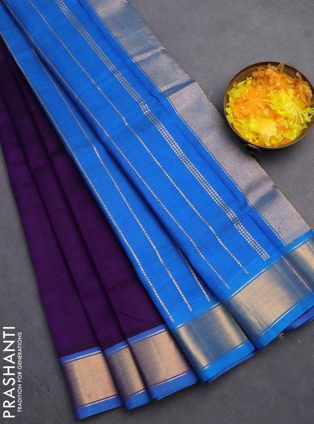 Silk cotton saree violet and cs blue with plain body and zari woven border