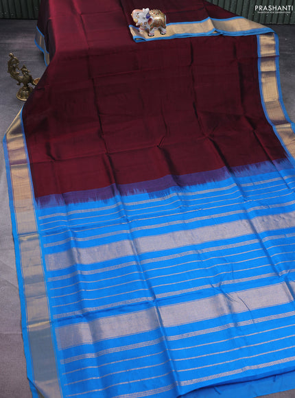 Silk cotton saree deep maroon and cs blue with plain body and zari woven border