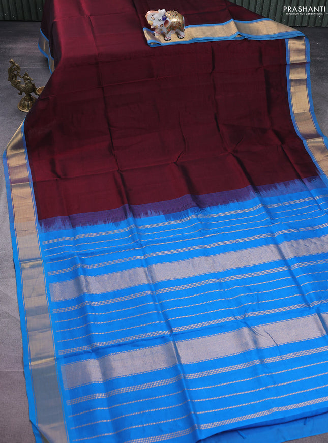Silk cotton saree deep maroon and cs blue with plain body and zari woven border
