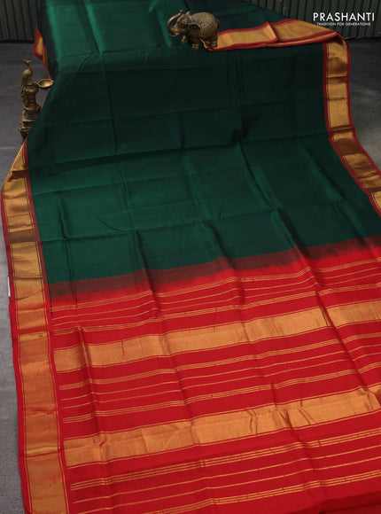 Silk cotton saree green and red with plain body and zari woven border