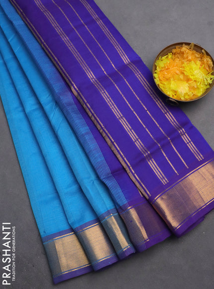 Silk cotton saree light blue and blue with plain body and zari woven border