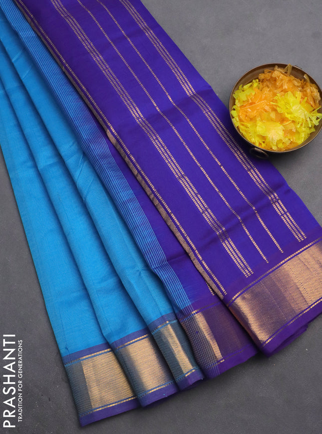 Silk cotton saree light blue and blue with plain body and zari woven border