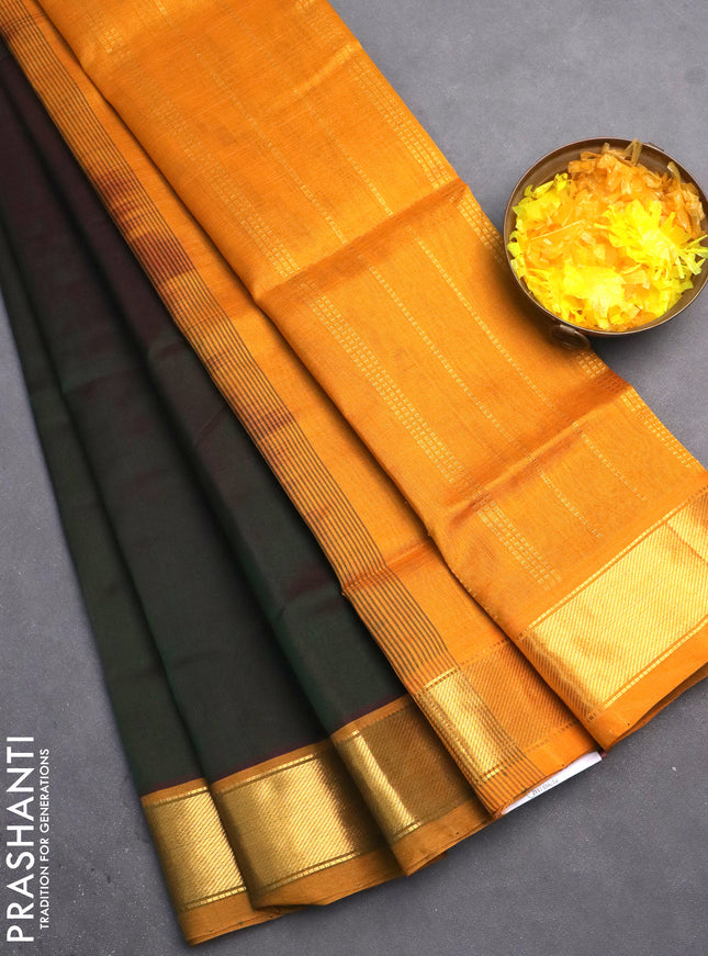 Silk cotton saree dual shade of green and mustard yellow with plain body and zari woven border