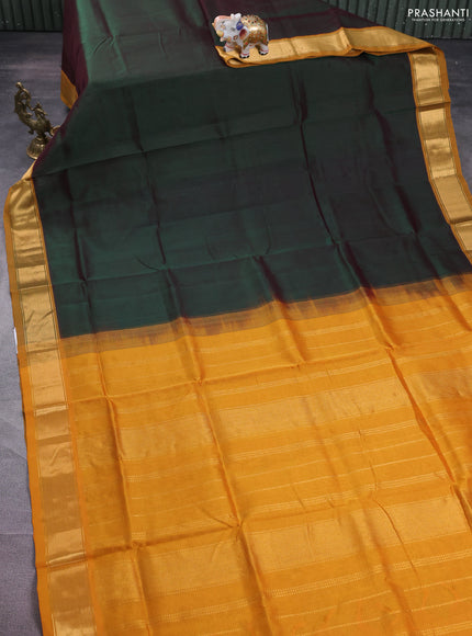 Silk cotton saree dual shade of green and mustard yellow with plain body and zari woven border