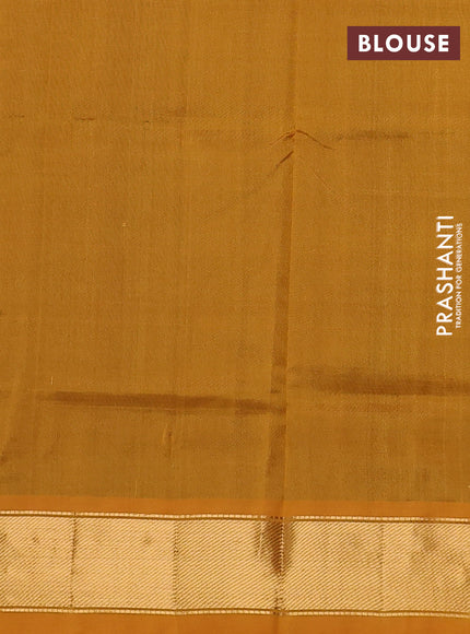 Silk cotton saree dual shade of green and mustard yellow with plain body and zari woven border