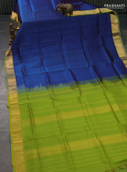 Silk cotton saree peacock blue and light green with plain body and zari woven border