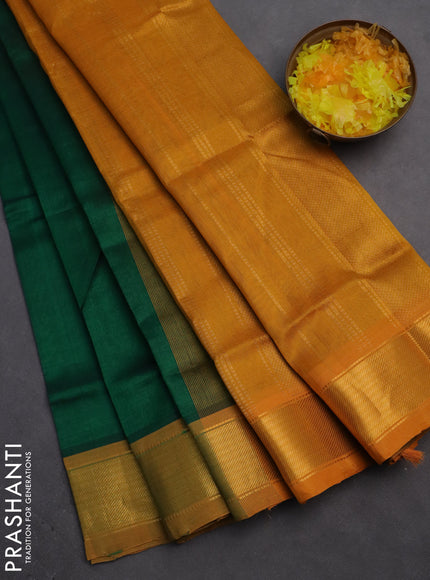 Silk cotton saree green and mustard yellow with plain body and zari woven border