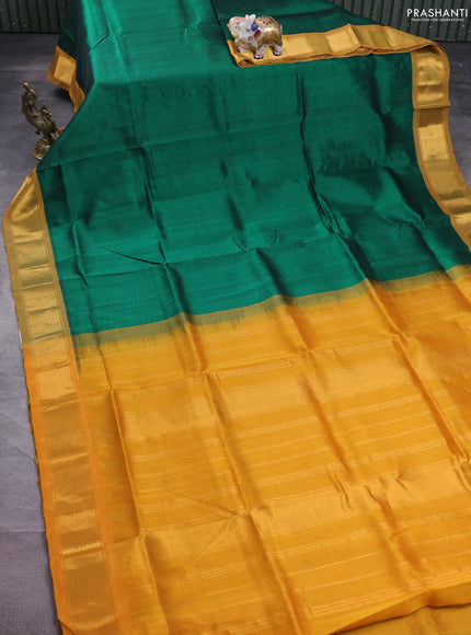Silk cotton saree green and mustard yellow with plain body and zari woven border
