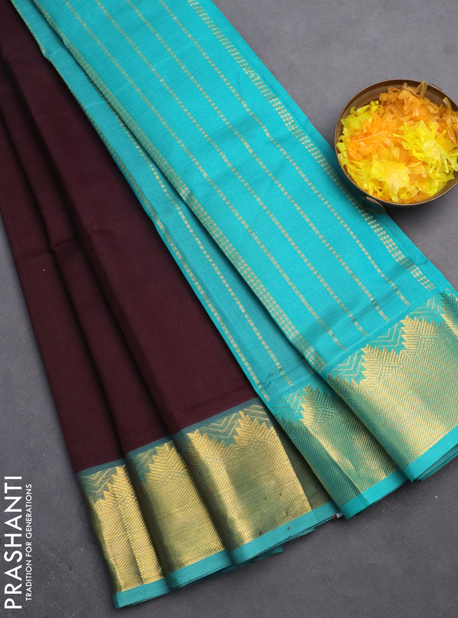 Silk cotton saree wine shade and teal blue with plain body and zari woven border