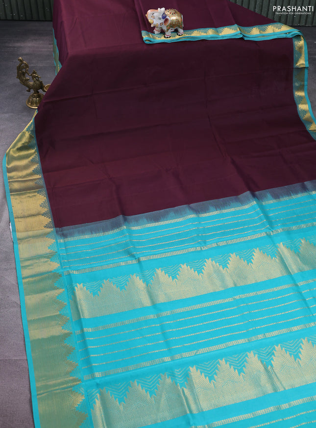 Silk cotton saree wine shade and teal blue with plain body and zari woven border