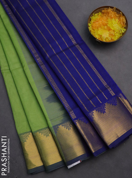 Silk cotton saree pista green and blue with plain body and zari woven border