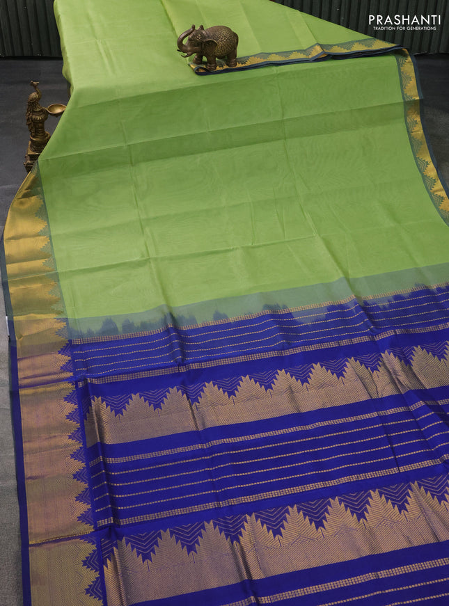 Silk cotton saree pista green and blue with plain body and zari woven border