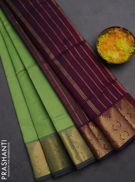 Silk cotton saree pista green and wine shade with plain body and zari woven border
