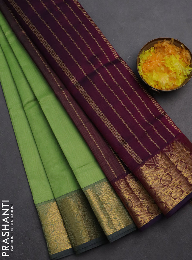 Silk cotton saree pista green and wine shade with plain body and zari woven border