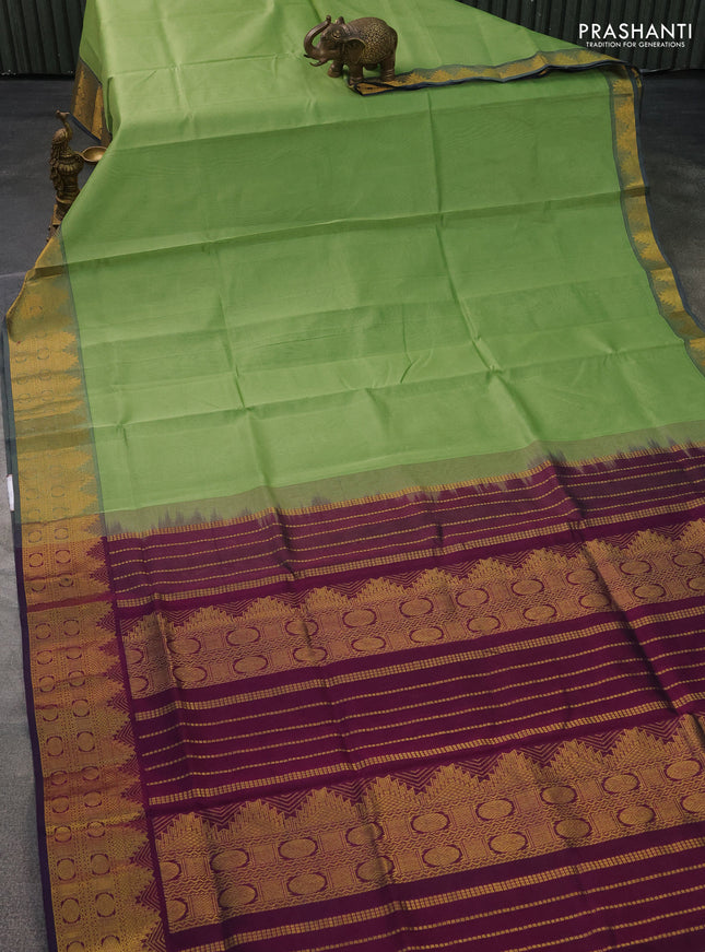 Silk cotton saree pista green and wine shade with plain body and zari woven border