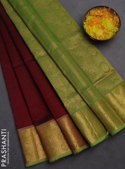 Silk cotton saree maroon and light green with plain body and zari woven border