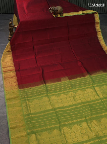 Silk cotton saree maroon and light green with plain body and zari woven border