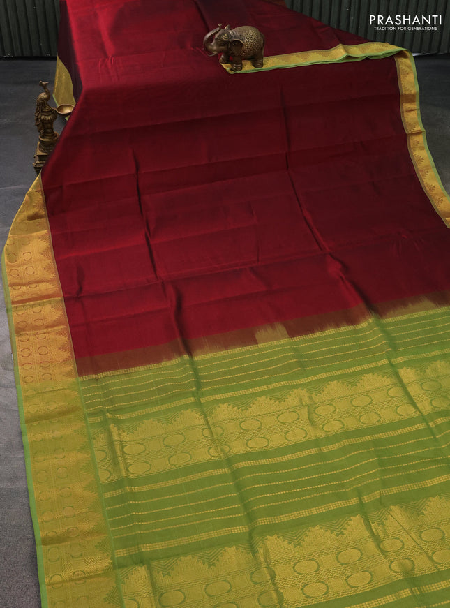 Silk cotton saree maroon and light green with plain body and zari woven border