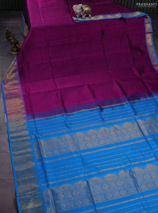 Silk cotton saree purple and cs blue with plain body and zari woven border