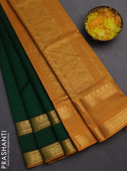 Silk cotton saree dark green and mustard yellow with plain body and rettapet zari woven border
