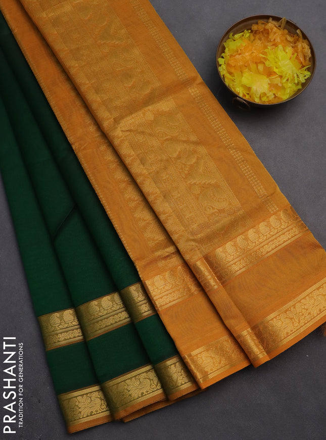 Silk cotton saree dark green and mustard yellow with plain body and rettapet zari woven border